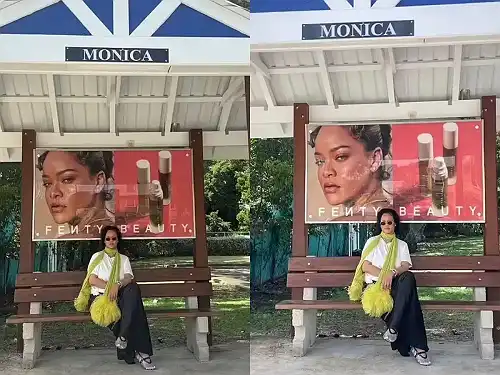 Rihanna keeps it cool in bus stop post with Fenty Beauty ad in background - Face2Face Africa