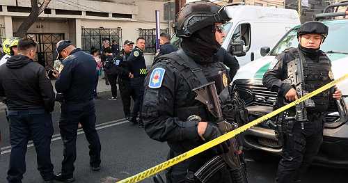 Mexico City mayor's personal secretary and adviser shot dead in the street by gunmen on motorcycle