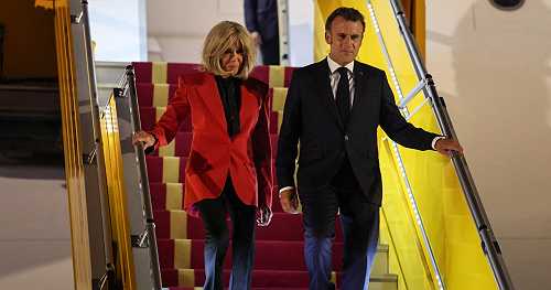 Brigitte Macron appears to push away husband and French President Emmanuel Macron's face upon arrival in Hanoi