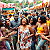 Post: The image displays a lively and joyful street festival scene with Black men and women engaging in...